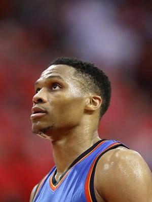 Oklahoma City Thunder guard Russell Westbrook looks at the scoreboard late in the fourth quarter while the Thunder play the Houston Rockets in the second half in Game 5 of the first round of the 2017 NBA Playoffs.