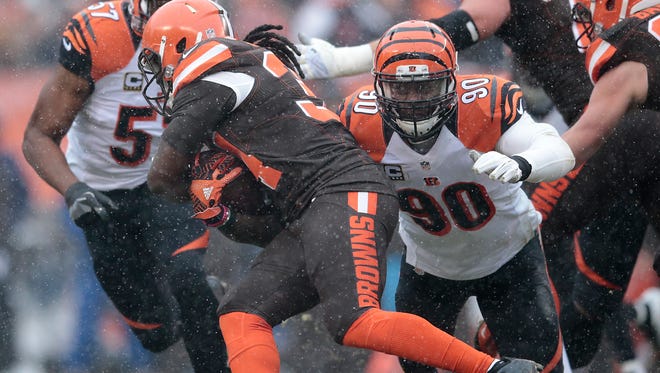 Cincinnati Bengals defensive end Michael Johnson (90) tackles Cleveland Browns running back Isaiah Crowell (34) in the second quarter during the Week 14 NFL game between the Cincinnati Bengals and the Cleveland Browns, Sunday, Dec. 11, 2016, at FirstEnergy Stadium in Cleveland. Cincinnati won 23-10.