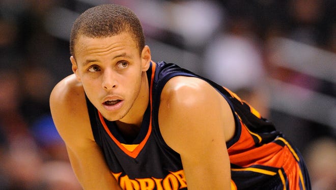 Flip through the gallery to see Golden State Warriors star Stephen Curry through the years.