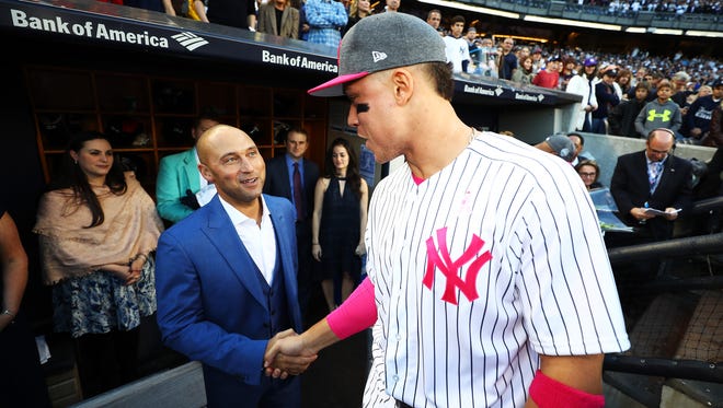 May 14: Aaron Judge meets Derek Jeter during the retirement ceremony of Jeter's number 2 jersey.