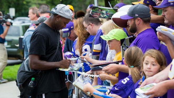 Minnesota Vikings defensive back Terence Newman (23) signs autographs at training camp at Minnesota State University.