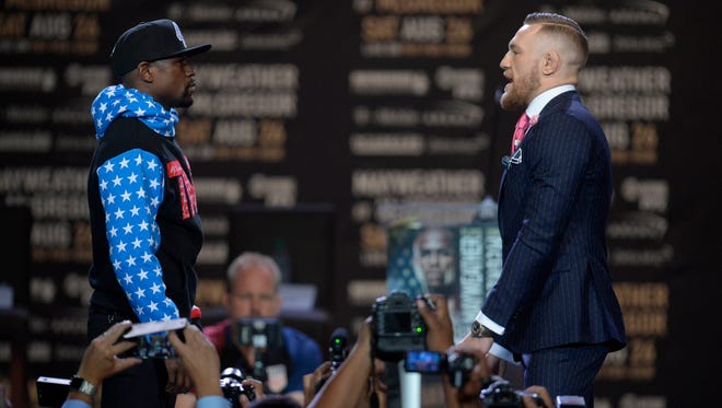 Conor McGregor stares at Floyd Mayweather during a world tour press conference at Staples Center in Los Angeles to promote the upcoming Mayweather vs McGregor boxing match.