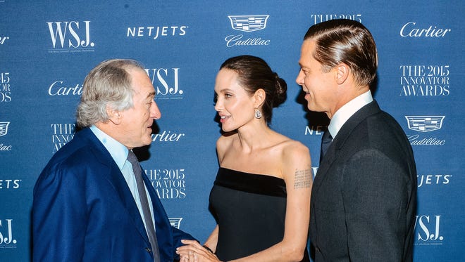 Robert De Niro chats with Angelina Jolie and Brad Pitt at the Museum of Modern Art in New York in November 2015.