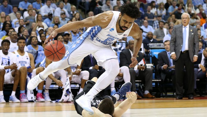 North Carolina Guard Joel Berry II drives to the basket past Butler center Nate Fowler during the second half of their game in the Sweet 16 of the NCAA Tournament at FedExForum in Memphis.