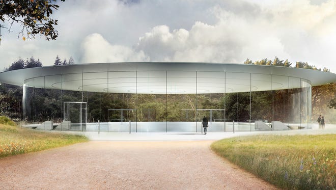 A digital rendering shows what the Steve Jobs Theater will look like at Apple Park, Apple's new 175-acre campus in Cupertino, Calif.
The entrance to the 1,000-seat auditorium is a 20-foot-tall glass cylinder, 165 feet in diameter, supporting a metallic carbon-fiber roof.