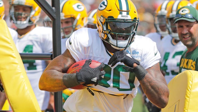 Green Bay Packers tight end Martellus Bennett (80) runs through a ball security drill  during training camp at Ray Nitschke Field.