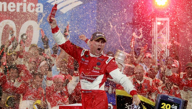 Kevin Harvick (4) celebrates in victory lane after winning after winning the Bank of America 500 at Charlotte Motor Speedway on Oct. 11, 2014.