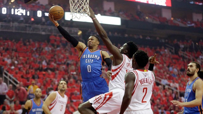 Oklahoma City Thunder guard Russell Westbrook (0) drives against Houston Rockets center Clint Capela (15) in the first quarter in game five of the first round of the 2017 NBA Playoffs at Toyota Center.