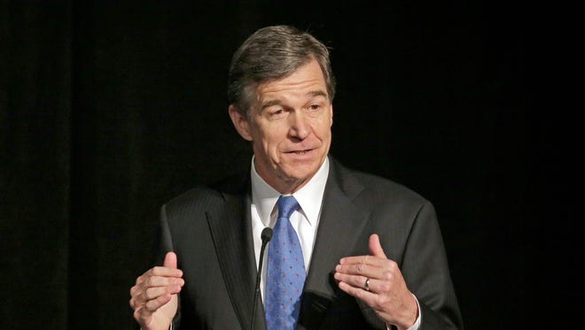 Roy Cooper, shown in a Jun3, 2016 file photo, filed suit to block bills passed by the General Assembly that would curb his power as the incoming governor.