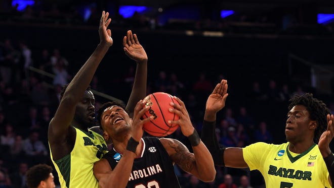 South Carolina forward Chris Silva (30) shoots against Baylor forward Johnathan Motley (5) during the first half of their game in the Sweet 16 of the NCAA tournament at Madison Square Garden in New York.