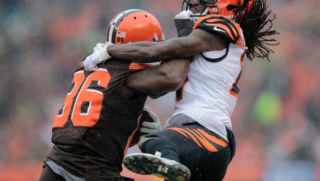 Cincinnati Bengals cornerback Dre Kirkpatrick (27) tackles Cleveland Browns tight end Randall Telfer (86) in the second quarter during the Week 14 NFL game between the Cincinnati Bengals and the Cleveland Browns, Sunday, Dec. 11, 2016, at FirstEnergy Stadium in Cleveland. Cincinnati won 23-10.