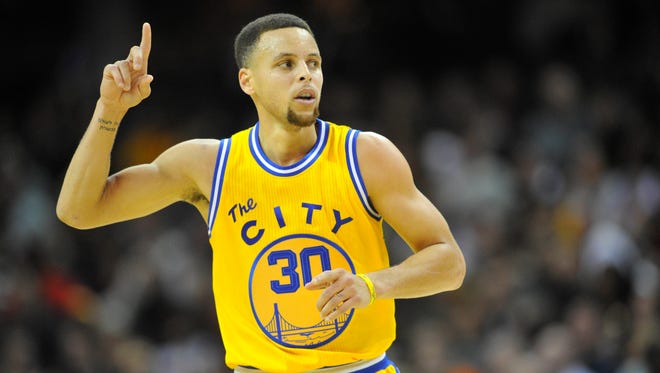 2016: Curry celebrates a three-point basket in the third quarter against the Cleveland Cavaliers.