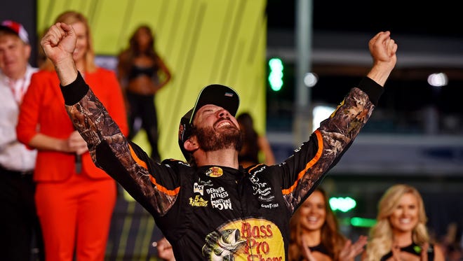 Martin Truex Jr. (78) celebrates winning the NASCAR Cup Series championship with a win in the Ford EcoBoost 400 at Homestead-Miami Speedway. The victory was his eighth of the season.