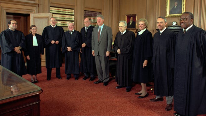 President Bill Clinton poses with members of the Supreme Court on Oct. 1, 1993. From left are Antonin Scalia, Ruth Bader Ginsburg, Anthony Kennedy, John Paul Stevens, Chief Justice William Rehnquist, the president, Harry Blackmun, Sandra Day O'Connor, David Souter and Thomas.
