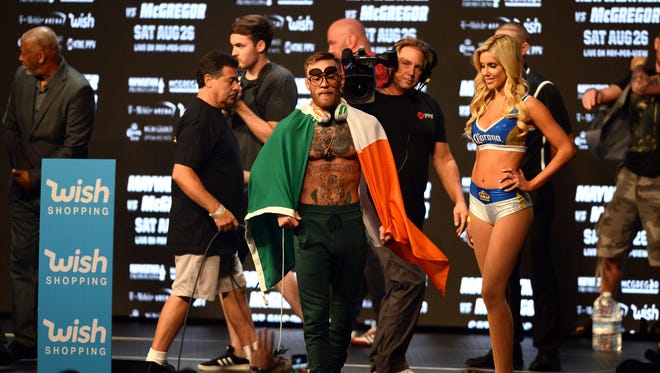 Conor McGregor enters the arena during weigh-ins for his upcoming boxing match against Floyd Mayweather Jr. (not pictured) at T-Mobile Arena.
