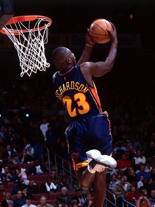 2002: Jason Richardson goes for a reverse dunk during the Slam Dunk Contest in Philadelphia. Richardson won the contest.