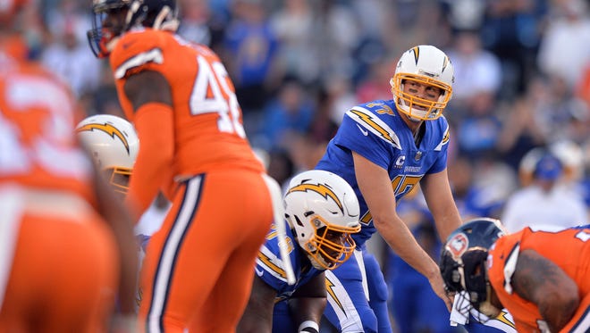 San Diego Chargers quarterback Philip Rivers (17) looks across the line before the snap during the first quarter against the Denver Broncos at Qualcomm Stadium.