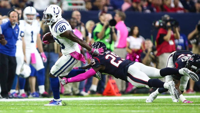 Colts wide receiver Chester Rogers (80) makes a reception as Texans safety Andre Hal (29) attempts to make the tackle during the first quarter.
