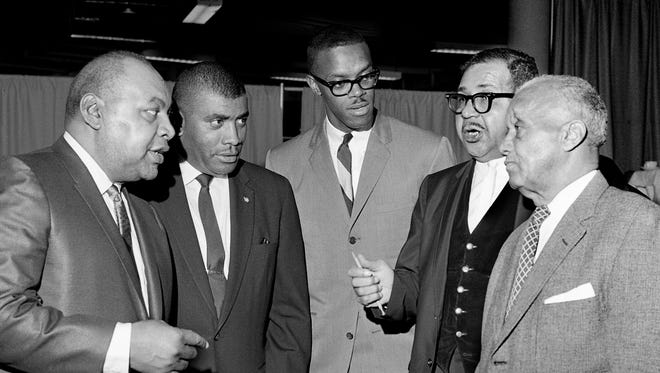 Lawrence Simmons, left, Ed Temple, Ralph Boston, W.V. Harper and Willie White are talking baseball as they gather to honor Los Angeles Dodgers star Junior Gilliam during his banquet at the Municipal Auditorium Dec. 10, 1965.