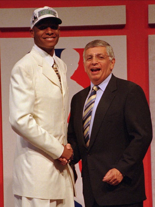 Ray Allen shakes hands with NBA Commissioner David Stern after being selected as the number five pick in the 1996 NBA draft by the Minnesota Timberwolves.