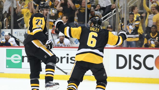 Pittsburgh Penguins center Evgeni Malkin (71) celebrates with defenseman Trevor Daley (6) after scoring a goal against the Nashville Predators during the first period of Game 1.