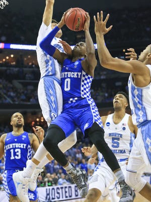 Kentucky's De'Aaron Fox couldn't score past UNC's Justin Jackson late in the second half as the Tarheels outlasted the Wildcats 75-73 Sunday at the Elite Eight game in Memphis.