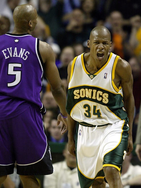 Ray Allen celebrates a basket late in the fourth quarter as he walks past Sacramento Kings Maurice Evans.