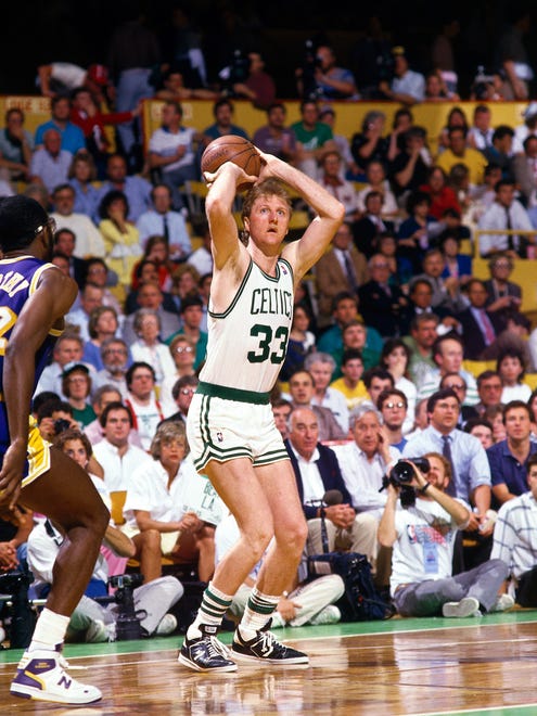 Larry Bird #33 of the Boston Celtics shoots a jumpshot against James Worthy of the Los Angeles Lakers during the NBA game at The Boston Garden on January 1, 1987 in Boston, Massachusetts.