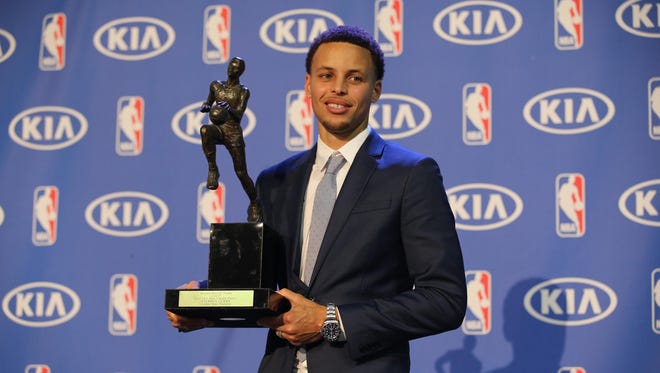 2015: Stephen Curry with the 2014-2015 NBA Most Valuable Player trophy at the Oakland Convention Center.