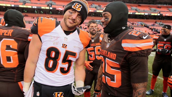 Cincinnati Bengals tight end Tyler Eifert (85) and Cleveland Browns running back George Atkinson (25) share a laugh at the end of the Week 14 NFL game between the Cincinnati Bengals and the Cleveland Browns, Sunday, Dec. 11, 2016, at FirstEnergy Stadium in Cleveland. Cincinnati won 23-10.