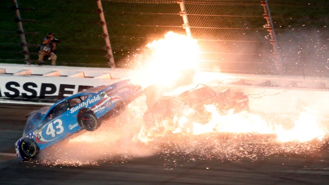 Aric Almirola (43) crashes into Danica Patrick and Joey Logano during the NASCAR Cup race at Kansas Speedway.