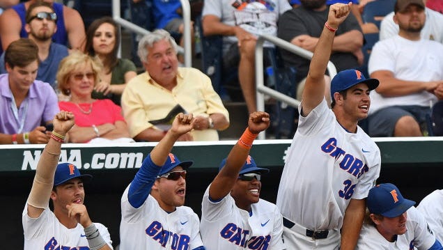 Florida players celebrate a hit against LSU in Game 2 of the College World Series.