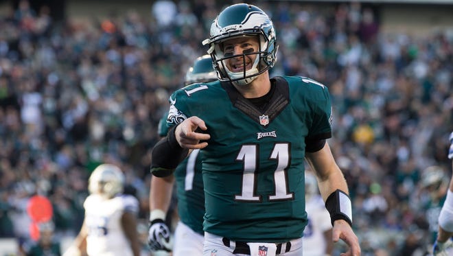 Philadelphia Eagles quarterback Carson Wentz (11) reacts to his touchdown pass to tight end Zach Ertz (not pictured) during the third quarter against the Dallas Cowboys at Lincoln Financial Field.
