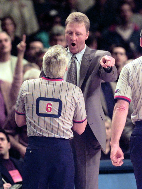 Pacers coach Larry Bird expresses himself to official Jim Clark during a 1998 game.