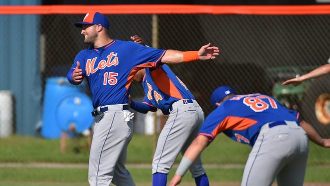Sept. 20: Tim Tebow stretches during his workout at the Mets Minor League Complex.