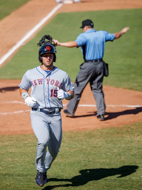 Oct 13: Tim Tebow is called safe by the umpire after scoring a run.