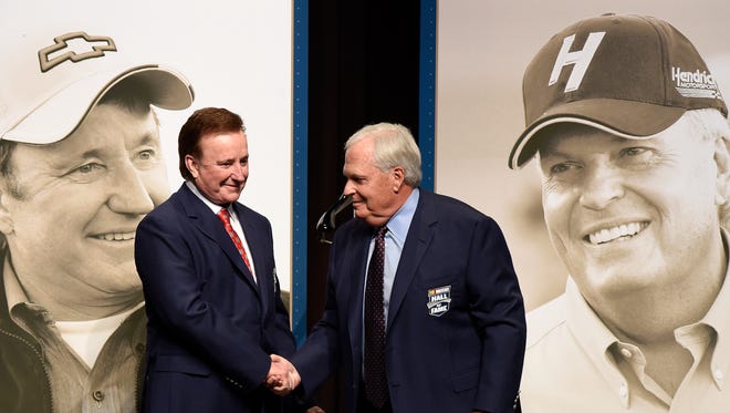 NASCAR team owners Richard Childress, left, and Rick Hendrick shake hands after receiving their Hall of Fame jackets prior to the Class of 2017 induction ceremony Friday night.