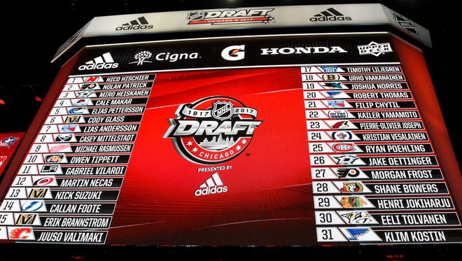 A general view of a video board displaying all thirty-one first round selections in the 2017 NHL Draft at the United Center.