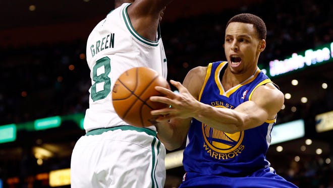 2013: Stephen Curry passes the ball against Boston Celtics power forward Jeff Green.