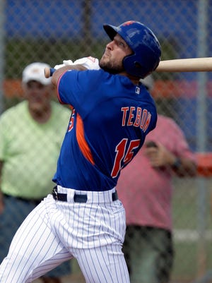 Tim Tebow hits a solo home run in his first at bat.