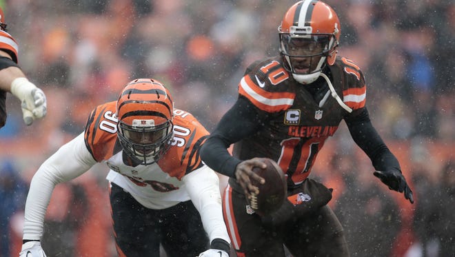 Cincinnati Bengals defensive end Michael Johnson (90) pressures Cleveland Browns quarterback Robert Griffin III (10) in the second quarter during the Week 14 NFL game between the Cincinnati Bengals and the Cleveland Browns, Sunday, Dec. 11, 2016, at FirstEnergy Stadium in Cleveland.