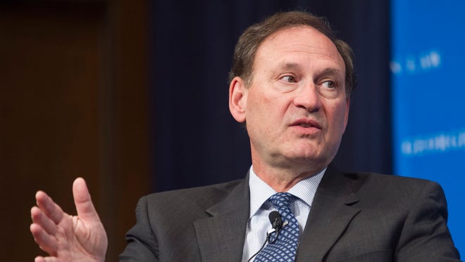 Supreme Court Justice Samuel Alito gestures while speaking at Georgetown University Law Center on Tuesday.