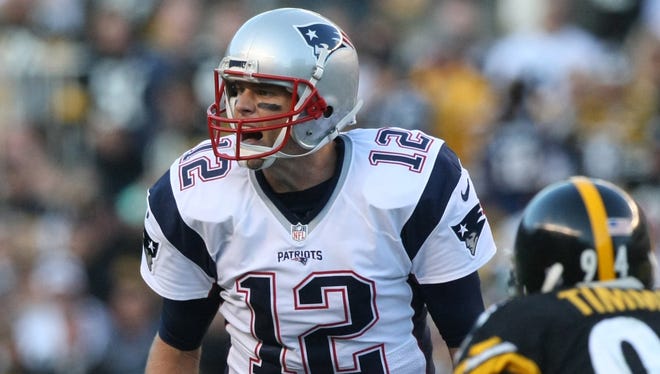 Patriots quarterback Tom Brady calls a play against the Steelers.