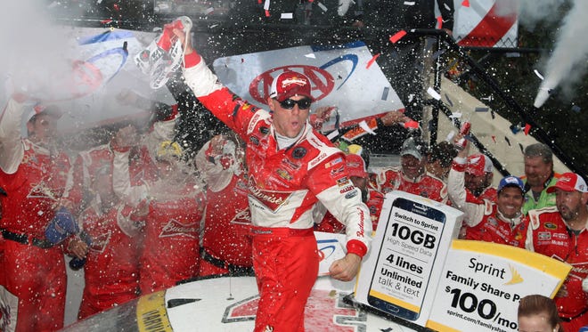 Kevin Harvick celebrates in victory lane after winning the AAA 400 at Dover International Speedway. It was Harvick's third win in 2015 and he would finish the season second in the standings.