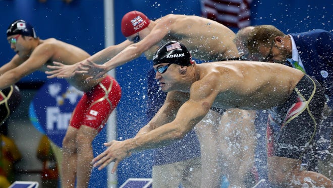Nathan Adrian (USA) dives in for the final length during the men's 4x100 medley relay final.