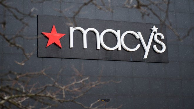 Macy's names a new president and is eliminating about 100 jobs.