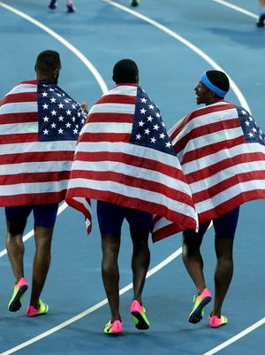 The USA 4x100 relay before the announcement of the DQ.
