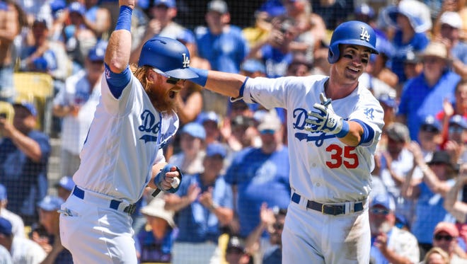 June 25: Cody Bellinger celebrates his first of two home runs, bringing his total to 24, in a 12-6 win over the Rockies. His six multi-homer games are the most ever by a rookie in Dodger history.