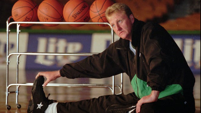 This is a January 29, 1996 file photo of Boston Celtic legend Larry Bird stretching at the Fleet Center in Boston.