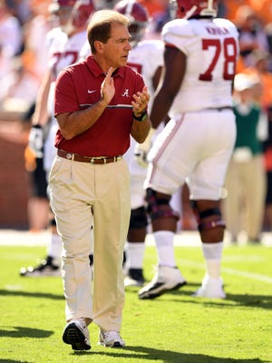 Alabama Crimson Tide head coach Nick Saban cheers on his team before the start of their game against the Tennessee Volunteers at Neyland Stadium.